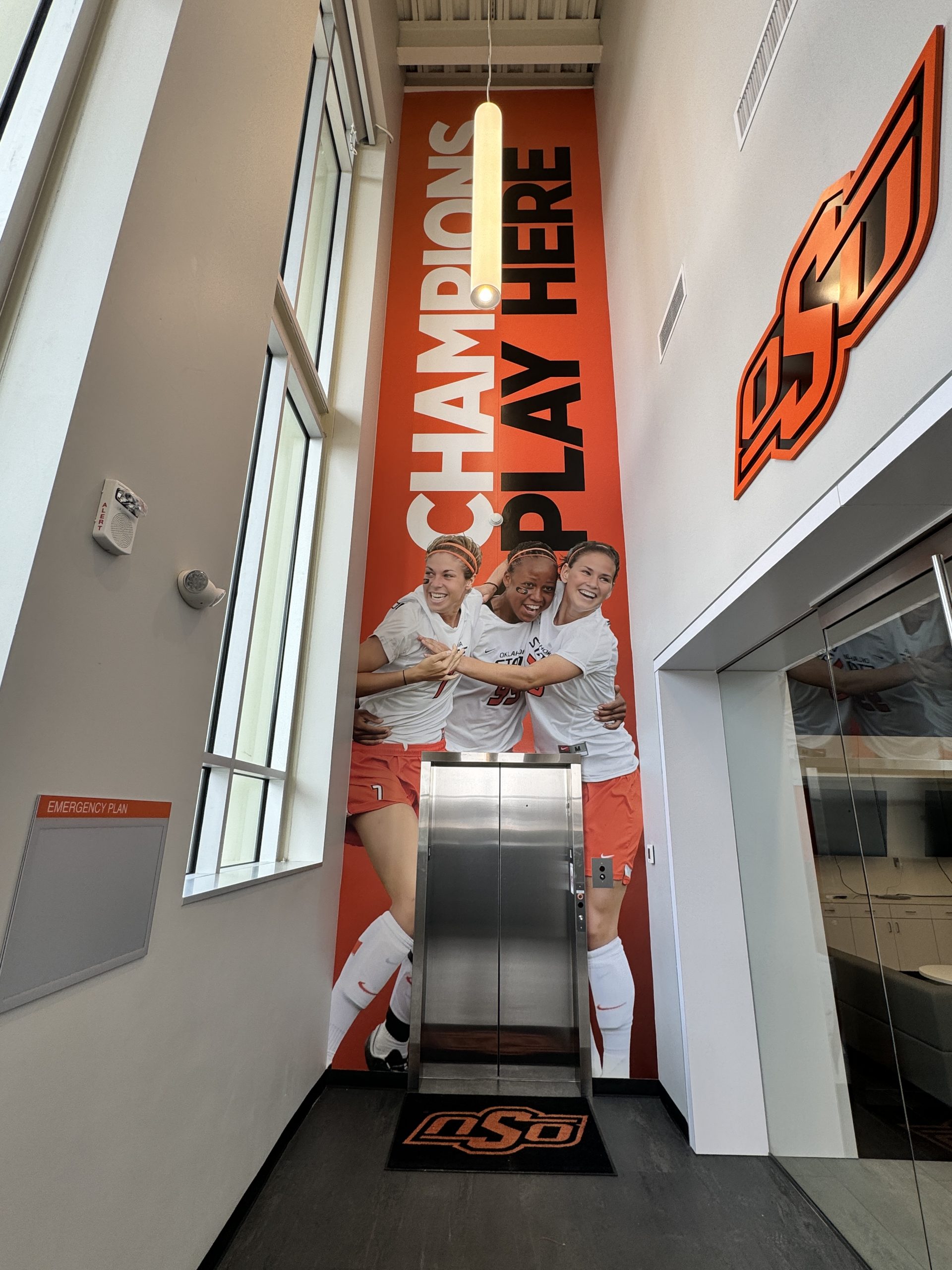 Oklahoma State University elevator wrap featuring team branding installed by Go Install That